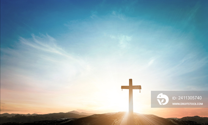 The cross on meadow autumn sunrise background