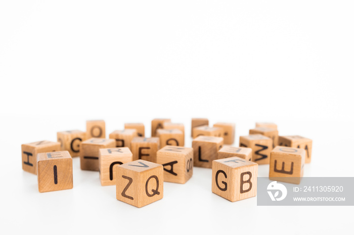 cube letters on a wooden table as a background