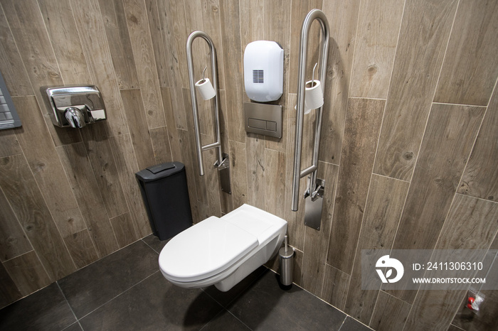 Toilet for elderly of disable people with handrail at the side