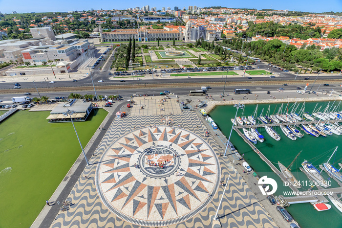 Panorama of Hieronymites Monastery or Mosteiro dos Jeronimos and giant mosaic of world map and compass from Discoveries Monument or Padrao dos Descobrimentos platform. Belem District, Lisbon, Portugal