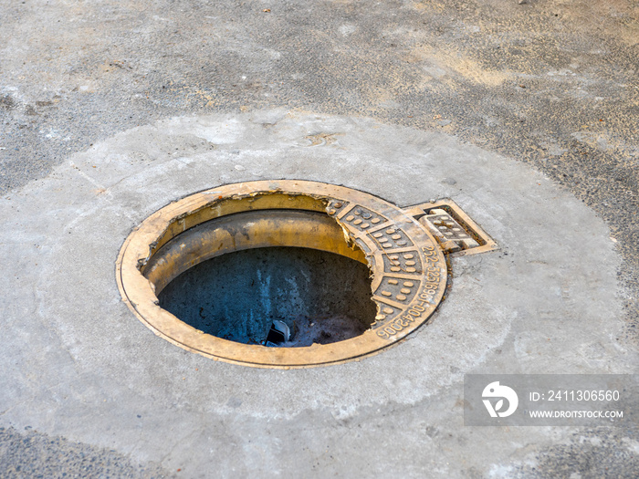 An open hatch. Broken manhole plastic cover.