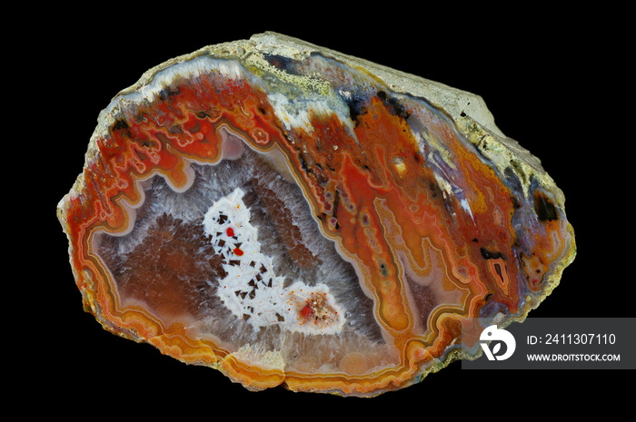 Amoeba agate filled with quartz. Colorful ribbons colored with metal oxides are visible. Origin: Rudno near Krakow, Poland.