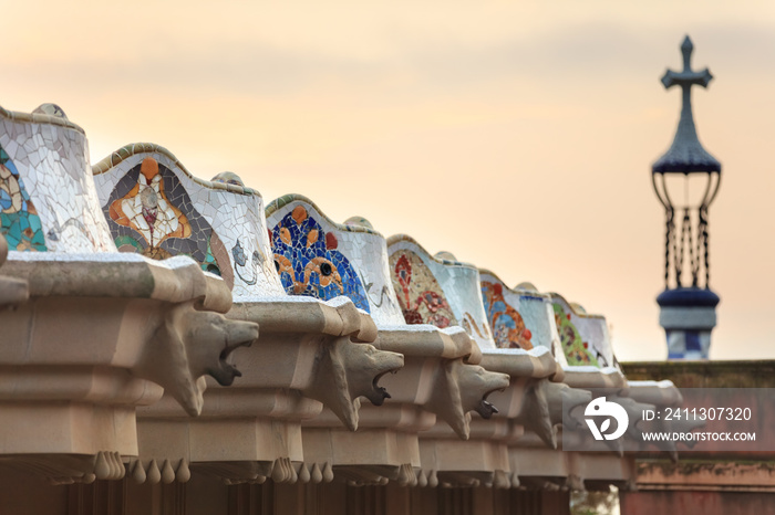 Park Guell in Barcelona. Doric columns with creature heads support the central terrace with serpentine seating