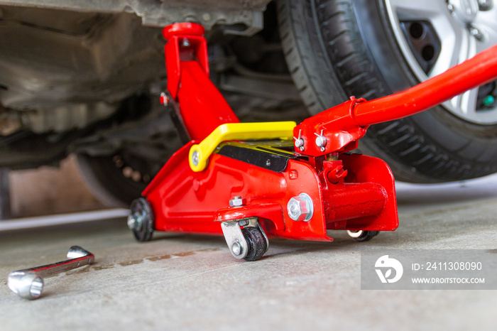 red tool jack lift car for repair check Maintenance of cars