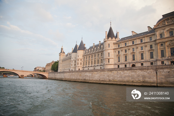 Palais de Justice standing on the banks of river Seine on the Ile de la Cite, Paris - France.