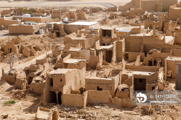 View of the small village Raghba with the abandoned mud houses in the middle of the desert in Saudi Arabia