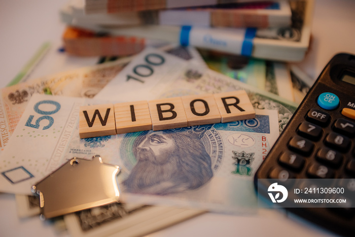 Napis wibor na tle banknotów