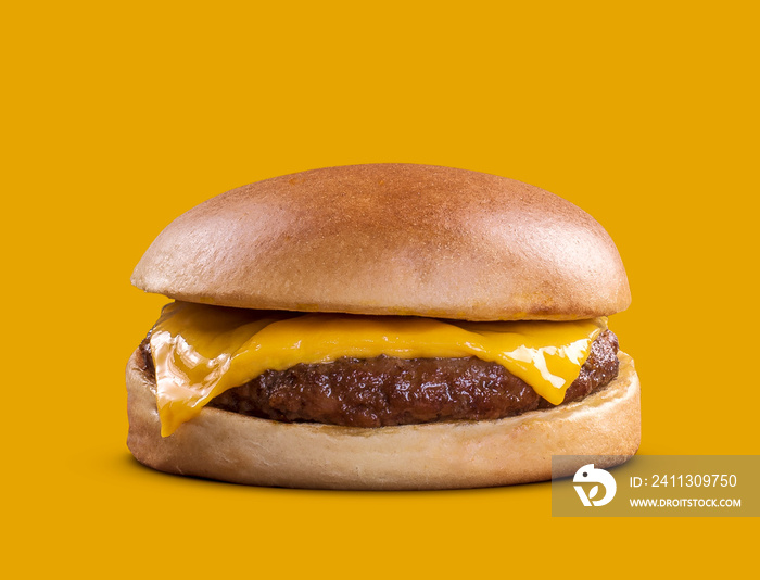 delicious fast food cheeseburger isolated on yellow background