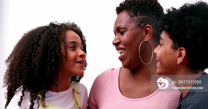 Candid mother and children relationship. Casual African mom and mixed race kids interaction