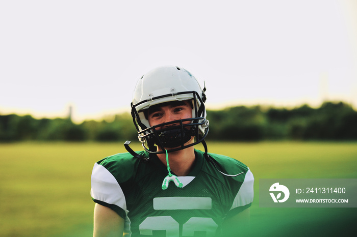 American football player standing on a field during practice