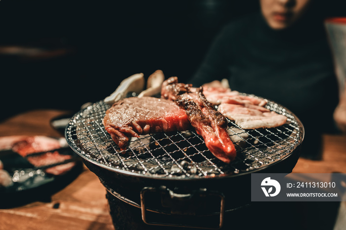 Close pork meat on a charcoal grill in restaurant.