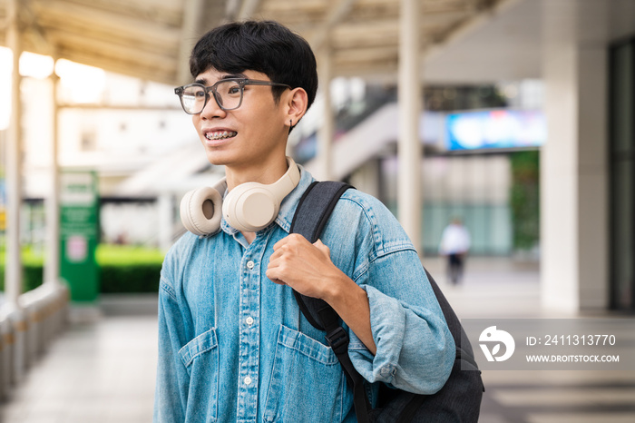 Portrait of Asian male student having fun at school