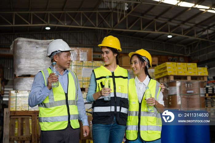 Portrait of staff  supervisor talking and standing in warehouse, Industrial and industrial workers concept.