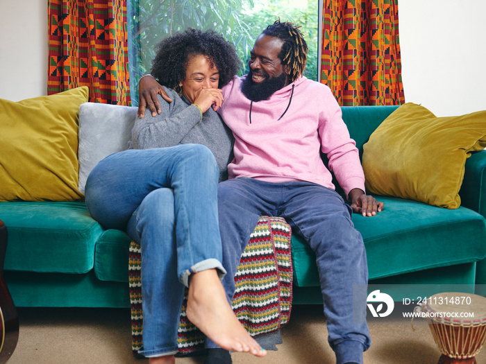 Couple relaxing on sofa