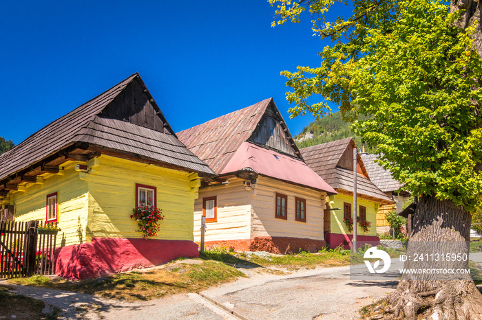 A street with ancient colorful houses in Vlkolinec village, Slovakia, Europe.