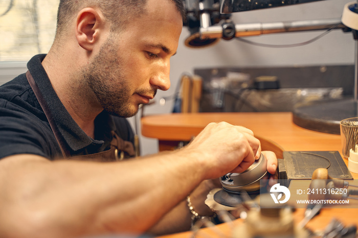 Focused young man working in a studio