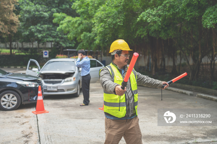 Traffic Man directing traffic after Crash Accident on the Road. Traffic police adjusts cars at the intersection of avenue, rush hour. Policeman regulating traffic