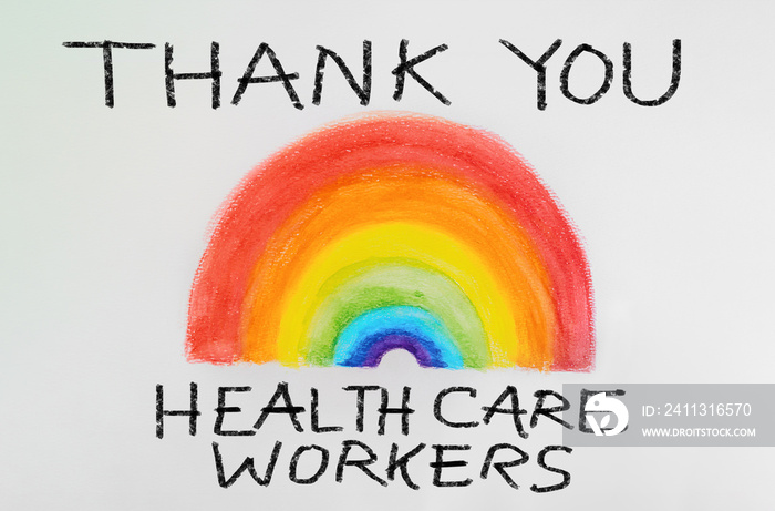 THANK YOU Healthcare workers rainbow drawing sign as appreciation support message for doctors and nurses fighting COVID-19 at hospitals. Coronavirus appreciation.