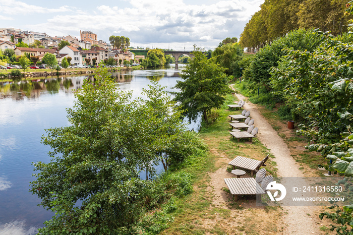 Chaise lounges on a pathway along the Vienne River in Limoges.