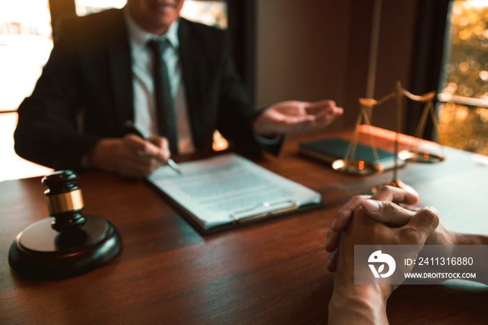 Lawyer is providing information about the client’s trial at the lawyer office.