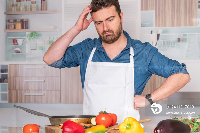 Worried man before cooking at home for dinner