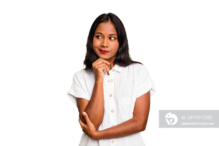 Young Indian woman isolated looking sideways with doubtful and skeptical expression.