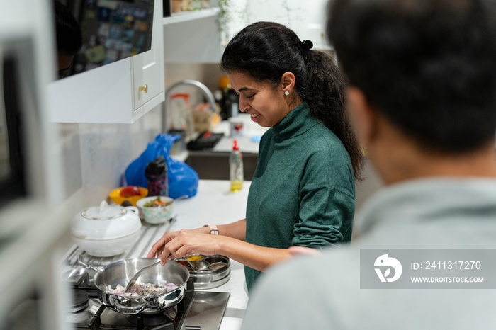 Woman cooking at home