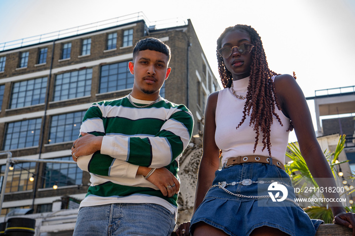 Fashionable young friends in city