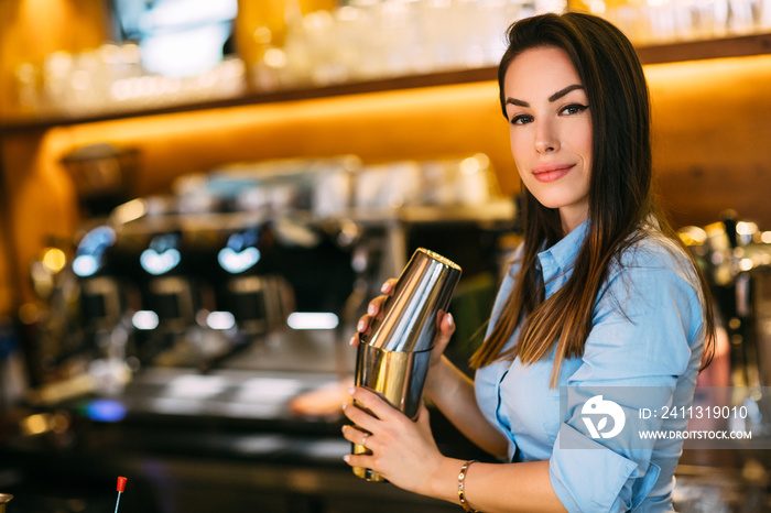 Girl shaking a cocktail