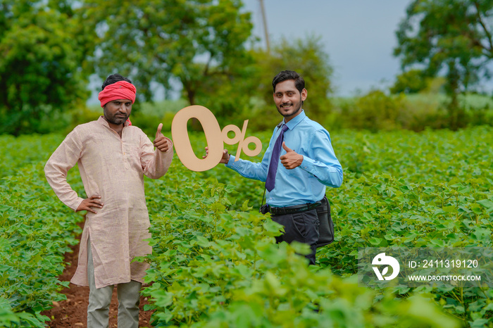 Young indian agronomist or financier showing zero percent symbol with farmer at agriculture field.