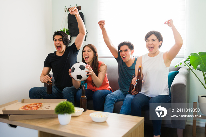 Excited friends rooting for their team