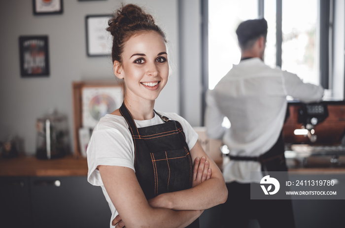 Smiling woman barista in apron, Coffee business owner