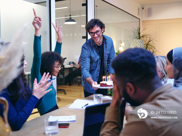 UK, London, Coworkers celebrating birthday in office