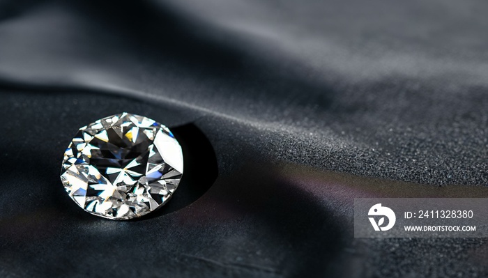 Several diamonds on a dark neutral background. The image represents luxury. Space for text.