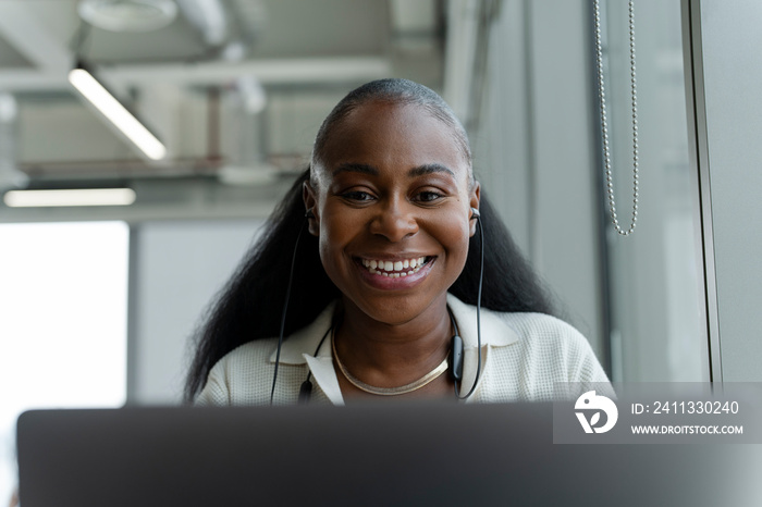 Businesswoman attending video conference in office