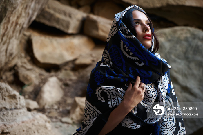 Beautiful muslim women with scarf. Muslim fashion model with oriental colorful shawl on head.