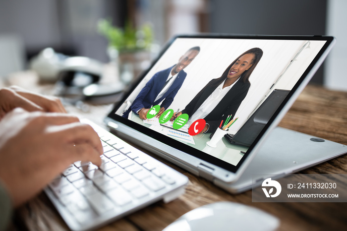 Businessman Video Conferencing With Co-worker On Tablet