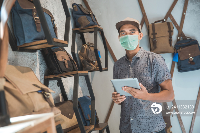 sick male business owner keep working and wear face masks