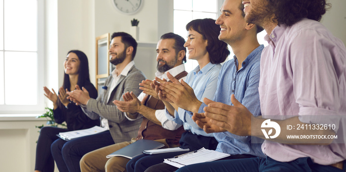 Happy audience applauding a speaker in a business conference. Banner with a group of people who liked the presentation in a corporate meeting clapping hands showing positive appreciation and gratitude