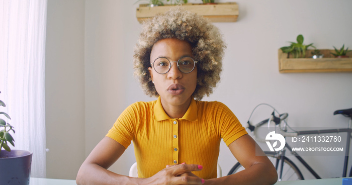 POV of a Black blogger woman recording video for social networks while explaining. Content creator, influencer, streaming