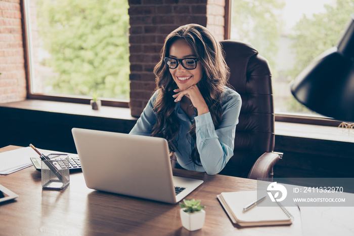 Close up photo beautiful she her business lady got promotion look screen speak skype sit big office chair working chatting investors hear good news glad answer wearing specs formal wear suit shirt