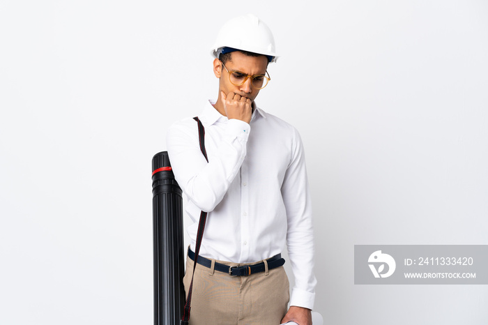 African American architect man with helmet and holding blueprints over isolated white background _ having doubts