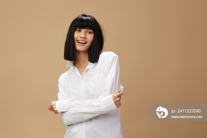 Happy enjoyed cute stylish adorable brunet lady in white shirt flirting smiling posing isolated on pastel beige studio background. Copy space Banner Offer. Pulp Fiction concept. Fashion Cinema