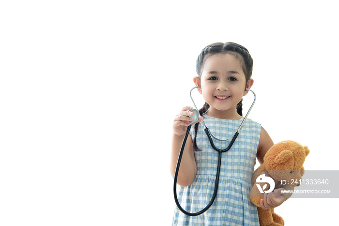 Medical so cute girl child smiling ,holding stethoscope and brown doll isolated on white background , healthy care kid concept