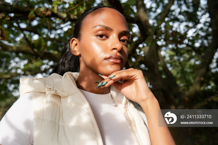 Portrait of woman in sunlight outdoors