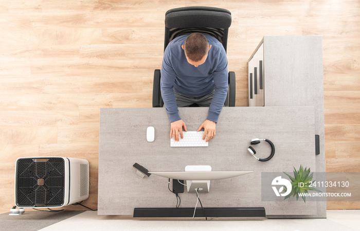 Home Office Worker in Front of Computer Top View