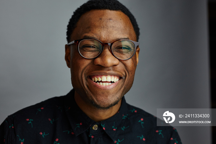 attractive young black male studio smiling at camera and laughing