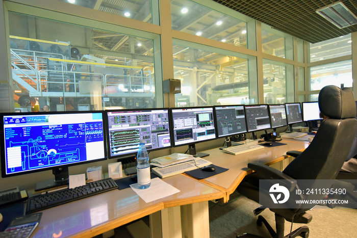 control center with screens in a paper mill - modern technology control