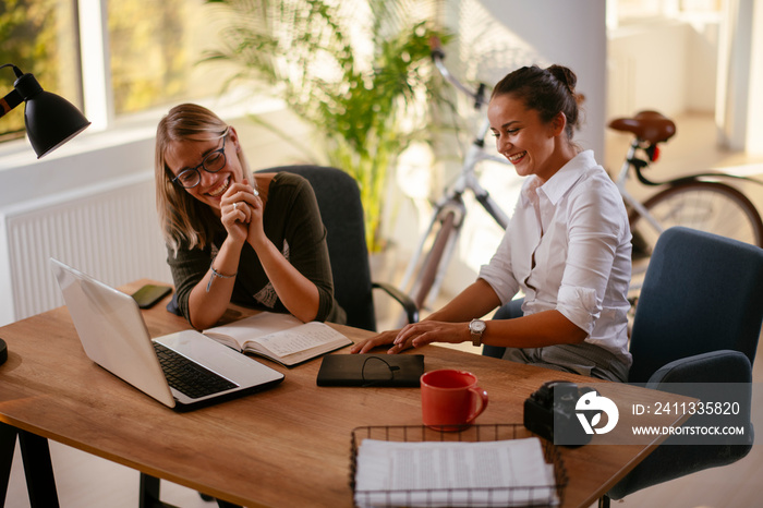 Businesswomen having fun in office