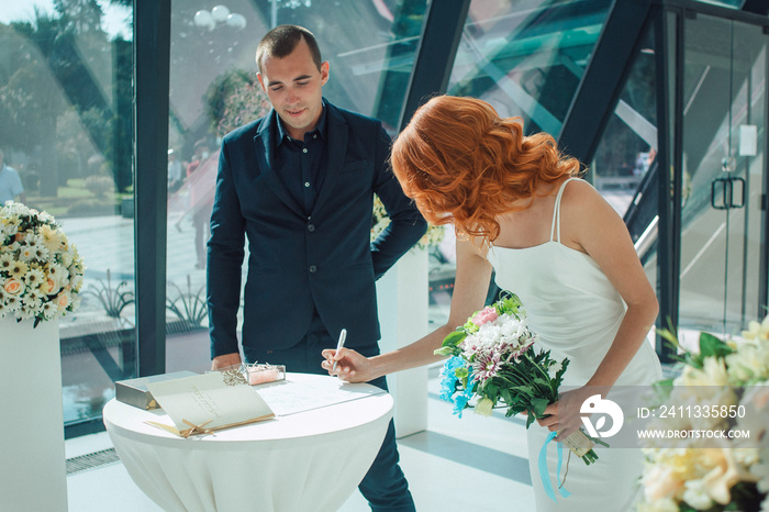 The Bride sign a document in registry office, wedding ceremony in Batumi.